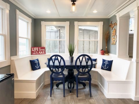 The kitchen includes custom built dining with lake views and an extra fridge!