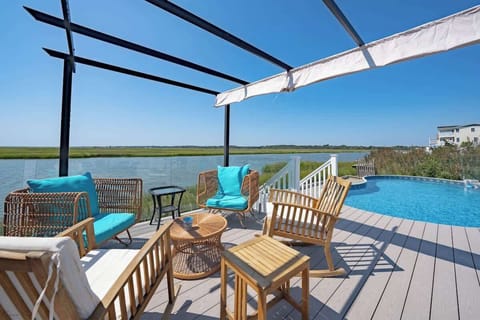 Private waterfront backyard with fire pit, yard games, and space for family gatherings.