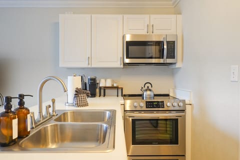 Brand new, stainless steel appliances.