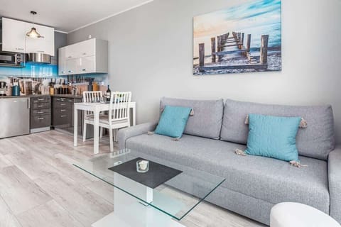 A close-up of the living room, highlighting its modern decor and seating arrangement.