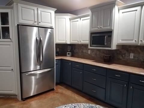 Spacious kitchen with extra large refrigerator, toaster, blender, crockpot, etc.