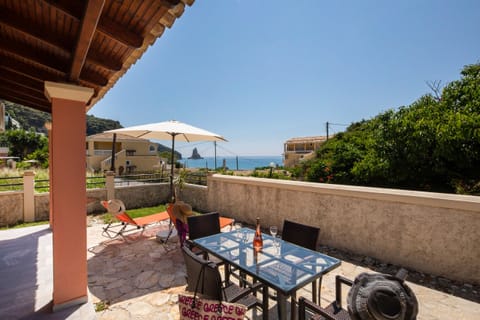 Outdoor dining and sunbathing terrace with views