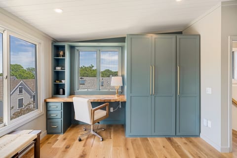 Built in desk and closets offering peeks of the ocean from your bedroom