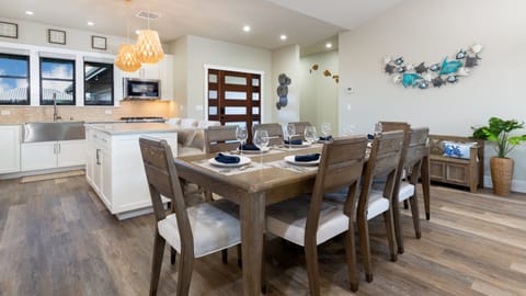 Indoor dining with room for 8 at table, and 3 at island