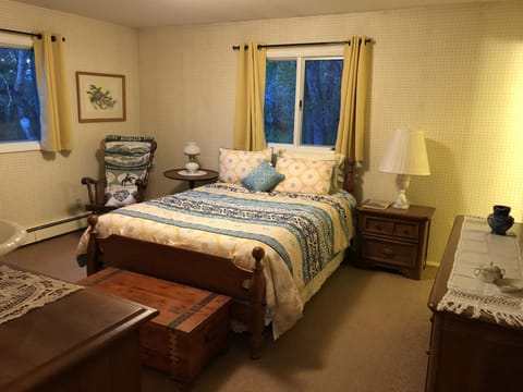 Master bedroom has a queen bed and a small private bathroom