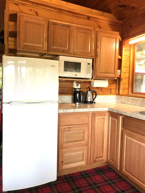 New cabinets in this kitchen. French press coffee maker or drip style.