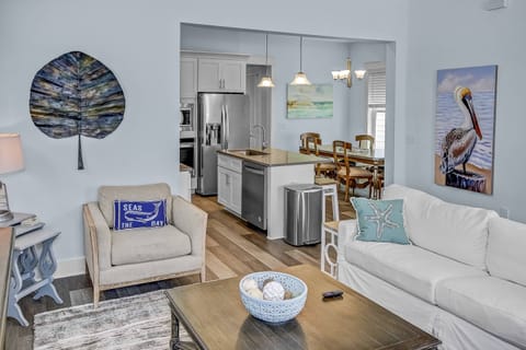 Beautifully decorated open-concept living, kitchen, and dining area