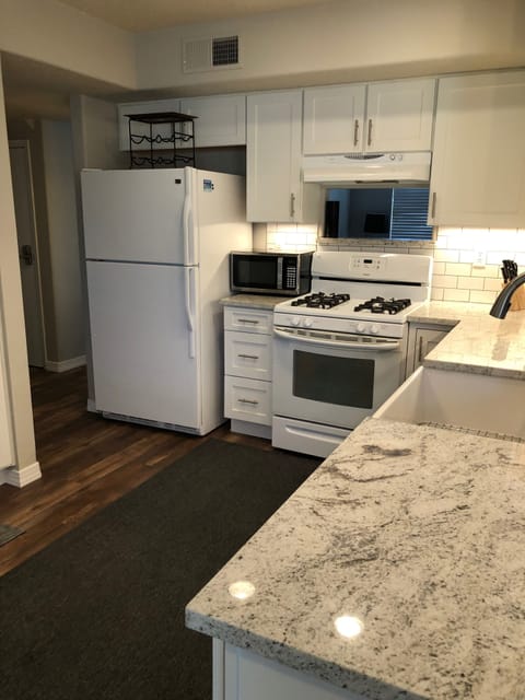 Kitchen with granite counter tops and farm sink