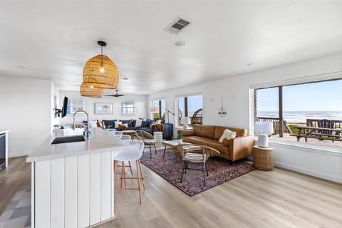 Open-concept living with ocean views from every angle — gather, relax, and stay connected to the coast.