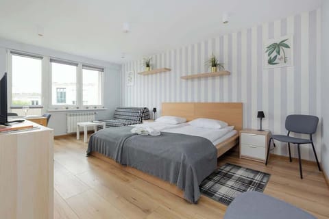 Bright and spacious studio apartment with modern Scandinavian décor.