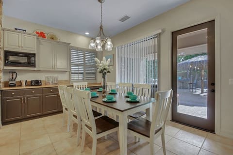 Take a break from the sun and enjoy your lunch inside at our dining table for 8.