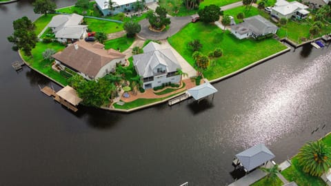 Waterfront home with dock on wide canal