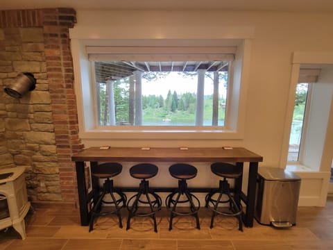 Basement bar across from kitchen