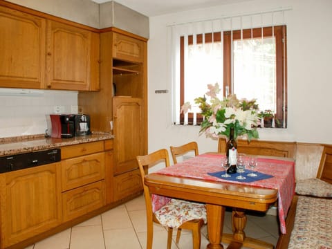 Furniture, Cabinetry, Countertop, Property, Flower, Table, Plant, White, Building, Window