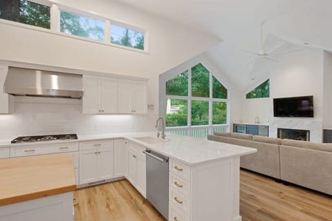 Kitchen eases into spacious family room or out to pool deck!