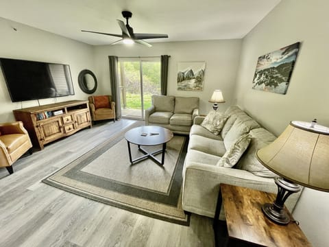 Family room with sleeper sofa and 55" smart TV for unit 2