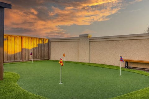 Your private backyard green—perfect for a morning practice or family fun