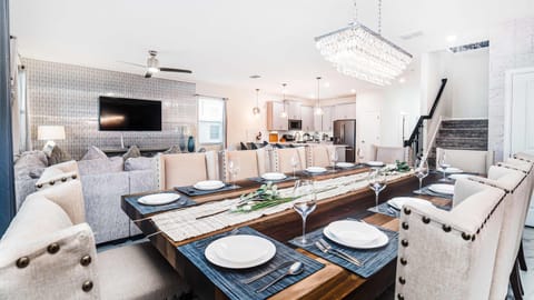 The dining area generously accommodates everyone with a grand 12-seater dining setup.