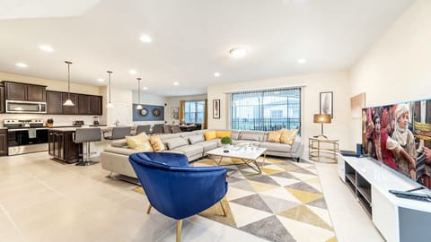 Living Room: Spacious and inviting, the area features a cozy sofa