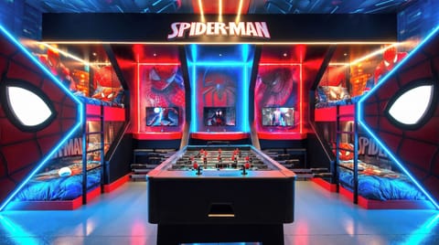 Epic Spider-Man themed game room with beds, foosball, and arcade fun!
