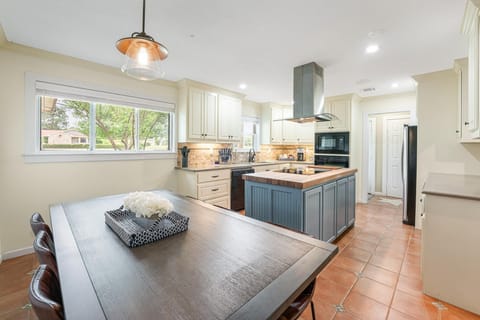 Large dining room table and kitchen