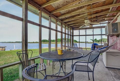 Covered porch on water perfect for coffee and reading in the hammock.  