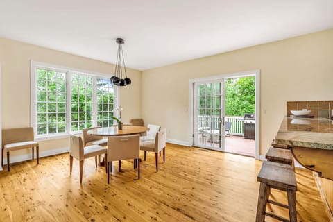 Dining Area. Table seats 7-8 people and breakfast bar seats 4. Total 11 to 12.