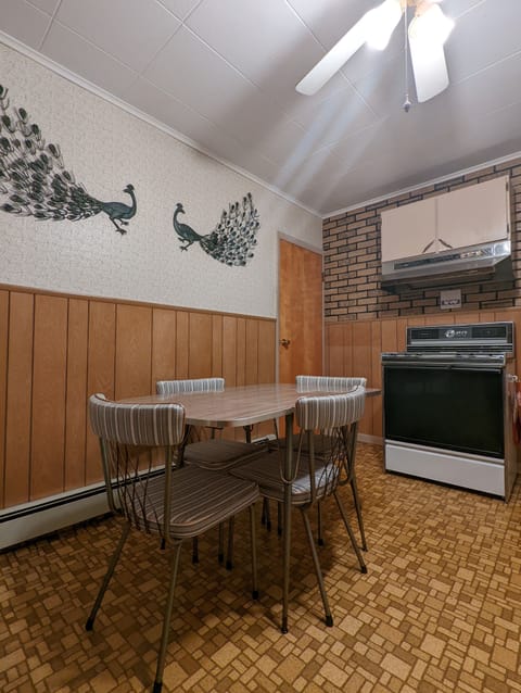 Dual leaf table with seating for four.