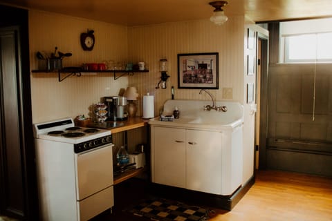 Kitchen w/small stove, full fridge, coffee pod machine, microwave, toaster.