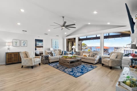 Center gathering spot of the home-enjoy lake views with these large windows!