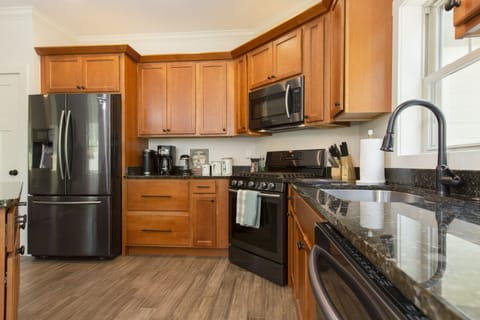 Gas stove and granite countertops.
