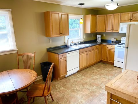 Eat-in kitchen with table for 4. Fully stocked with all cooking and serve ware.