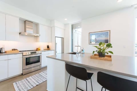 Each kitchen is equipped with everything you need to prepare a meal for your group, with quartz counter tops and breakfast bar seating for 6.