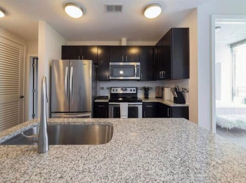 on the kitchen counter all sorts of appliances smoothie blender etc.