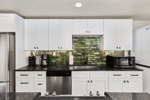 Kitchen with new appliances, well stocked supplies, and open feel (main level)