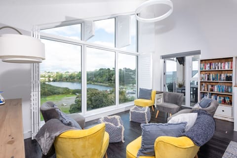 Seaview property, relaxing living space with bookcase - Swanpool View