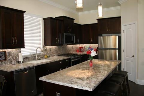 Island with bar stools to enjoy a snack or just to have a chat