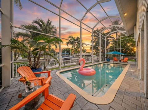 Relax in the heated, fully screened pool while enjoying unforgettable waterfront sunsets.