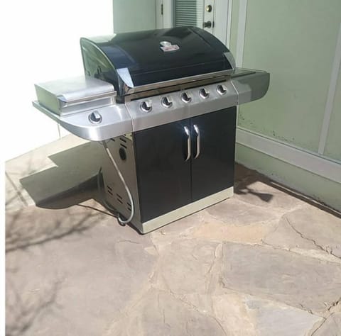 Natural Gas grill with some utensils