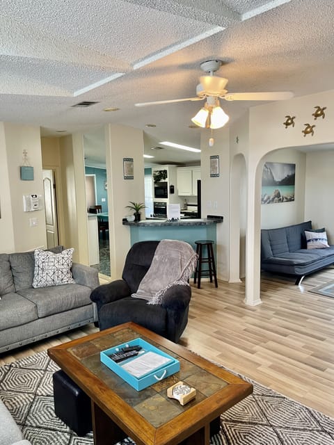 View of bar area, extra Rm & kitchen from TV Rm