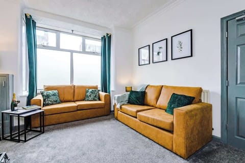 The spacious living room boasting a comfortable double sofa bed, 40-inch Smart TV with Netflix and plenty of space to sit down in the evenings.