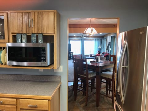 View from Kitchen through small dining area to main family room