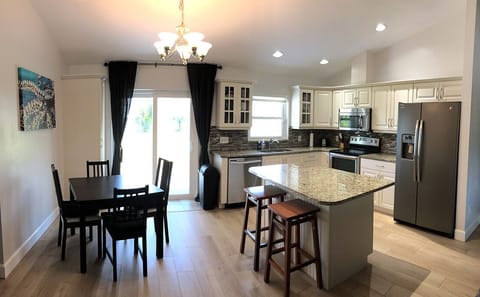 Bright & open well stocked kitchen and dinette.