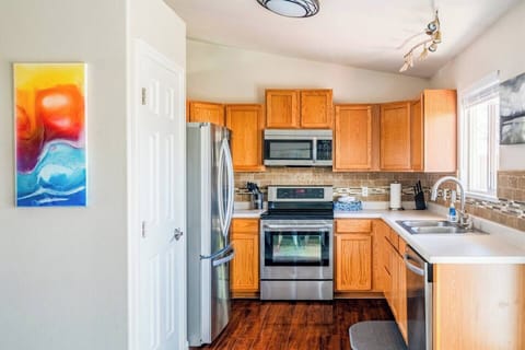 The kitchen is fully stocked, and the pantry has plenty of space to store food.
