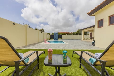 Lounge Chairs Facing The Pool Area