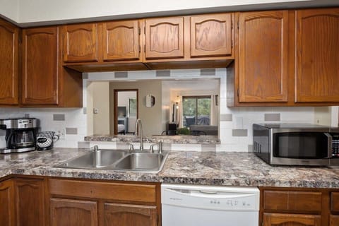 Kitchen looks into dining & living space