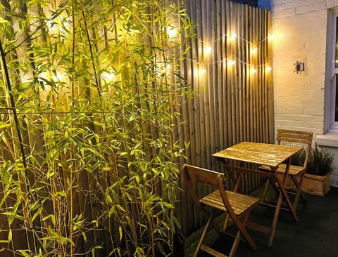 Pretty Fairy Lights at Night by the Bistro Set!