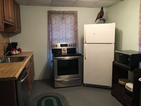 Fully equipped kitchen w full size refrigerator, flat top stove/oven &DISHWASHER