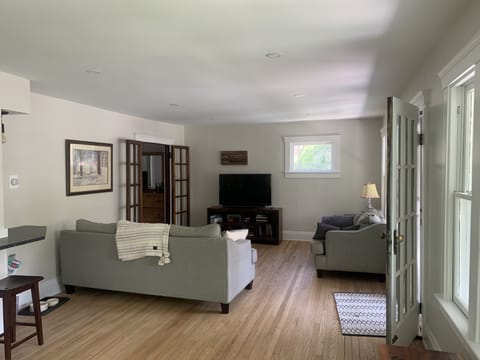 Long living room w 2 coaches a large smart tv