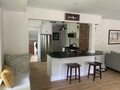 Granite counter tops and table - w stools and benches to have meals together.